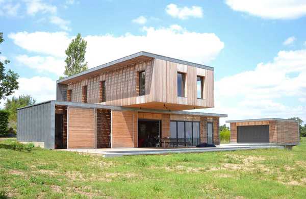 Réalisation d'une maison individuelle contemporaine avec bois et béton dans un esprit Loft par un architecte à Quimper.